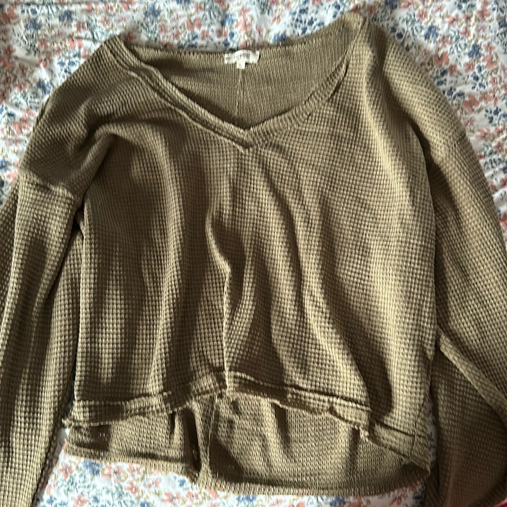 Crop knit like top and a brownish green color